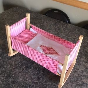 Wooden doll cradle.